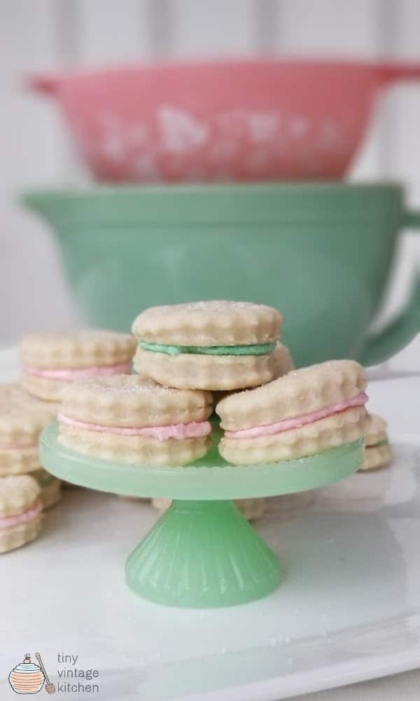 pink and green filled Old Fashioned Cream Wafer Cookies on green cake stand